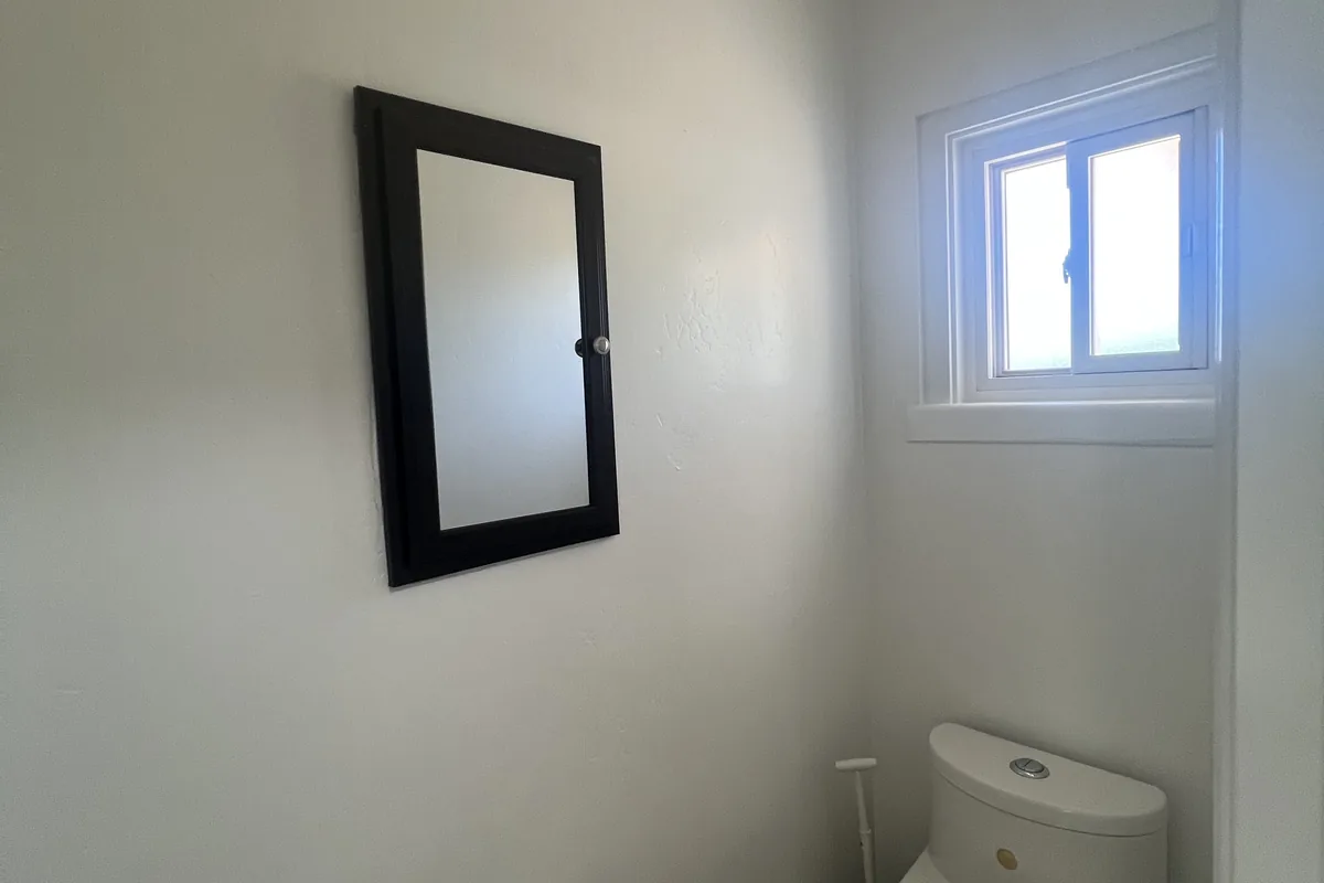 Bathroom wall and ceiling cut in around the mirror, a Tony's Painting job in San Diego County