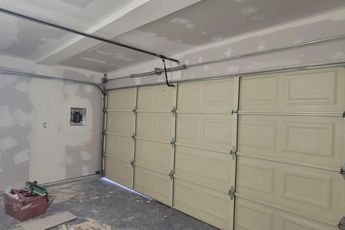 New drywall hung and taped along the garage wall, a Tony's Painting job in San Diego County