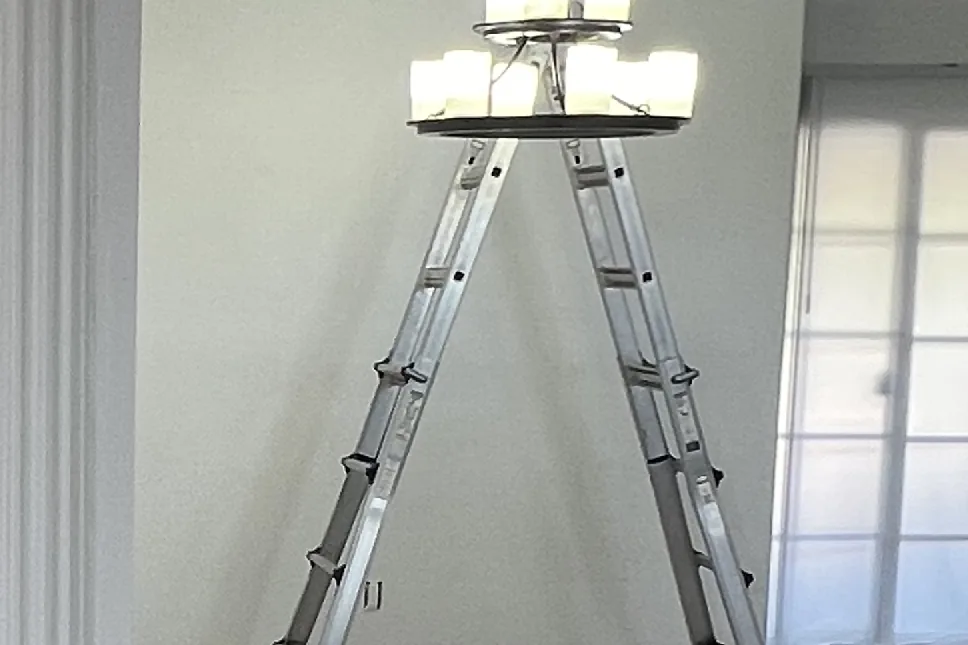 Ladder set and floors protected in the entry, a Tony's Painting job in San Diego County